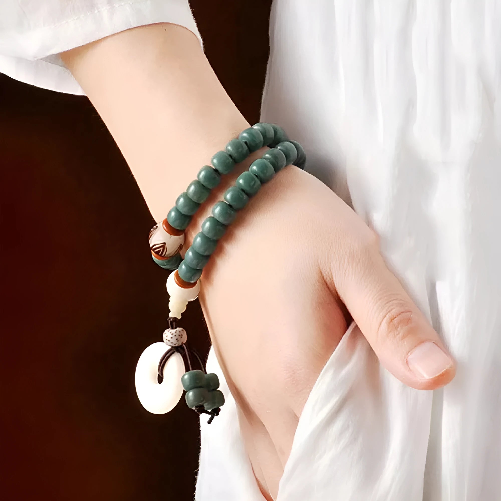 White Jade Bodhi Green Sandalwood beaded bracelet with a choice of safety buckle or lotus clasp.