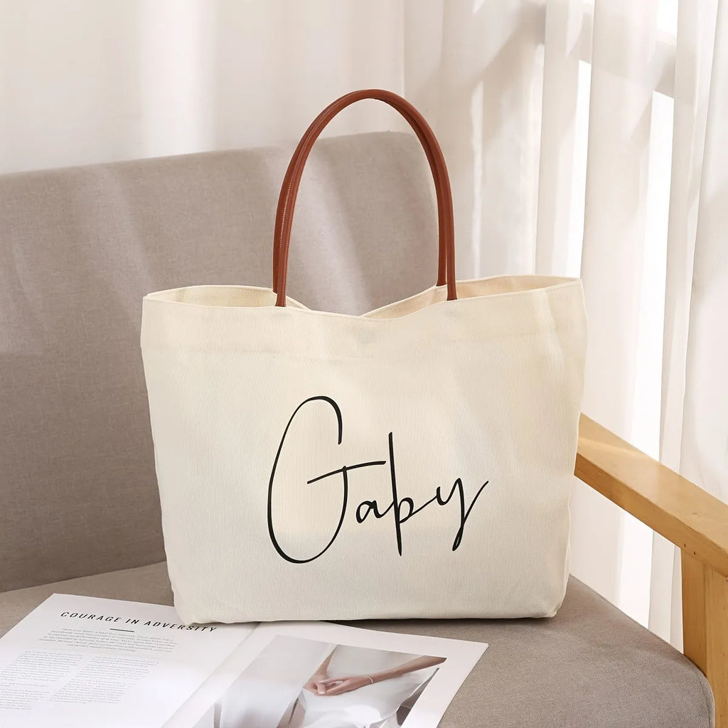 Canvas tote bag in cotton fabric with reinforced stitching, shown in beige white and white colour options