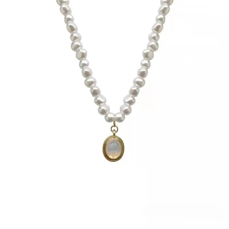 French court vintage style necklace with geometric alloy pendant and pearls on an adjustable chain.