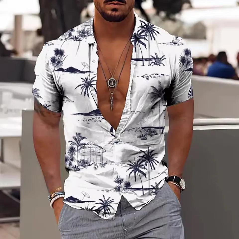Man wearing a loose-fitting short-sleeve shirt with a colourful floral print pattern.