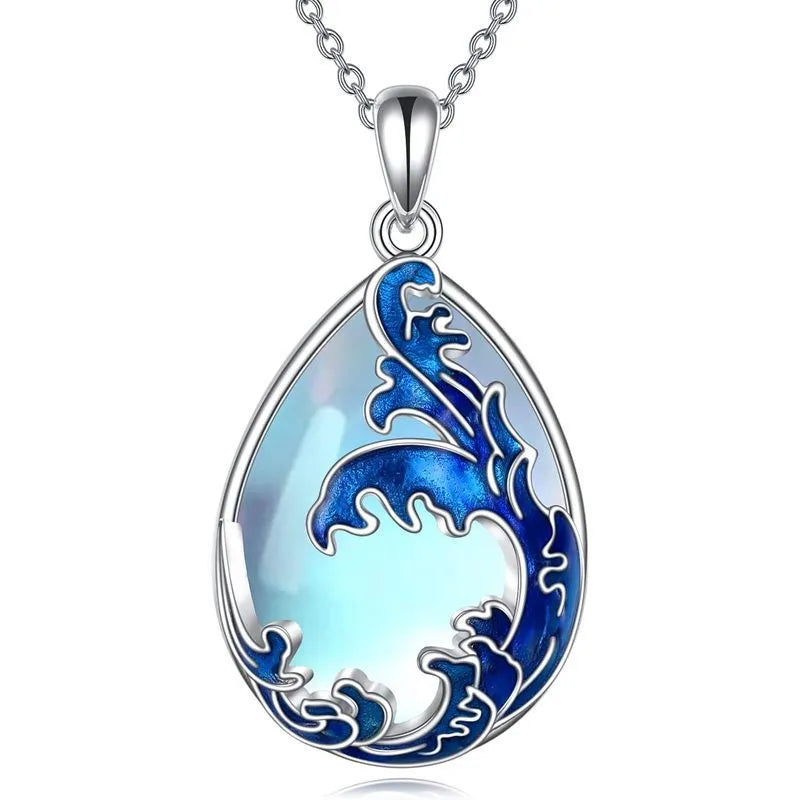 Blue heart-shaped alloy pendant necklace on a silver-tone chain.