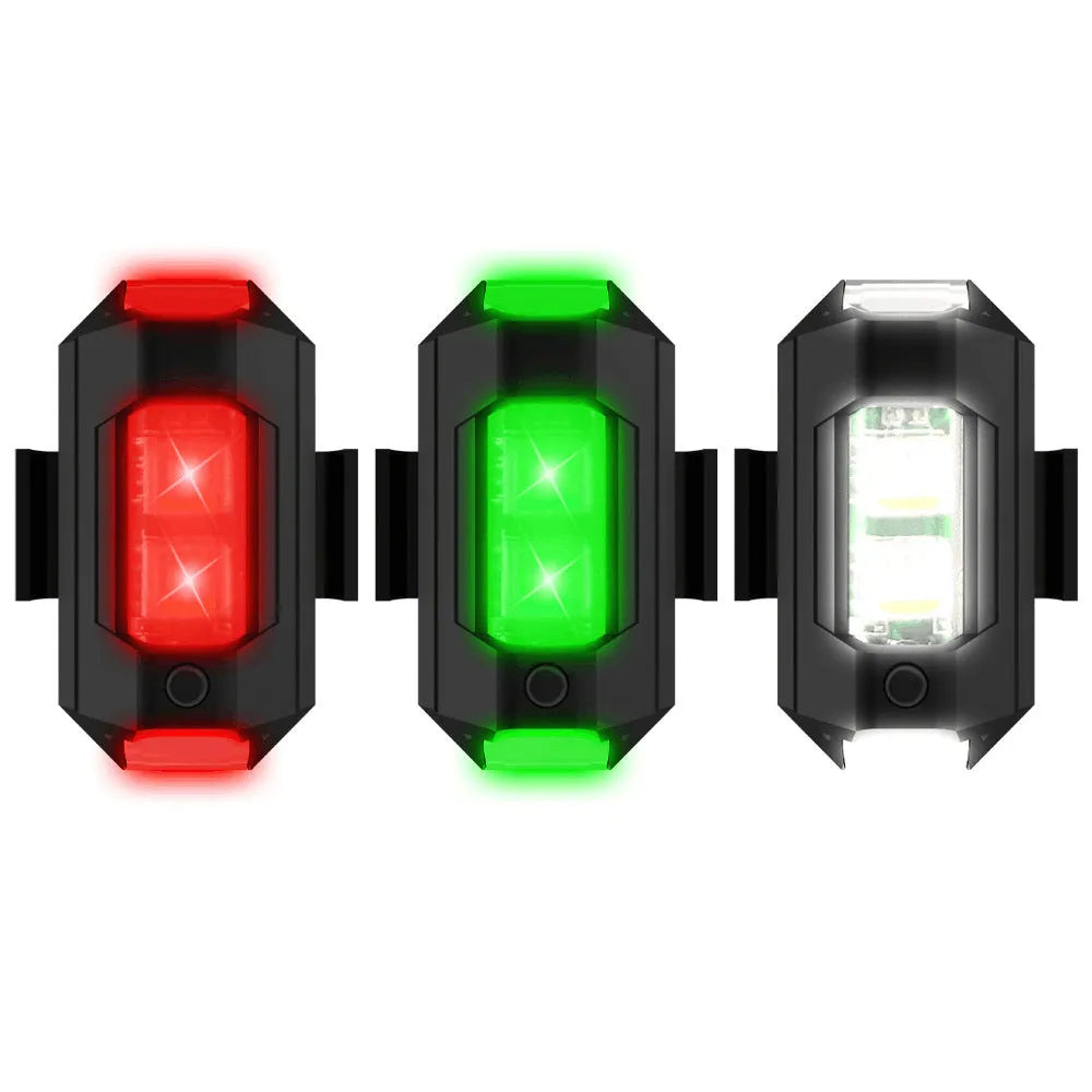 Drone signal light with RGB LED strobe, Type-C cable, fixing tape and ring belts on a table