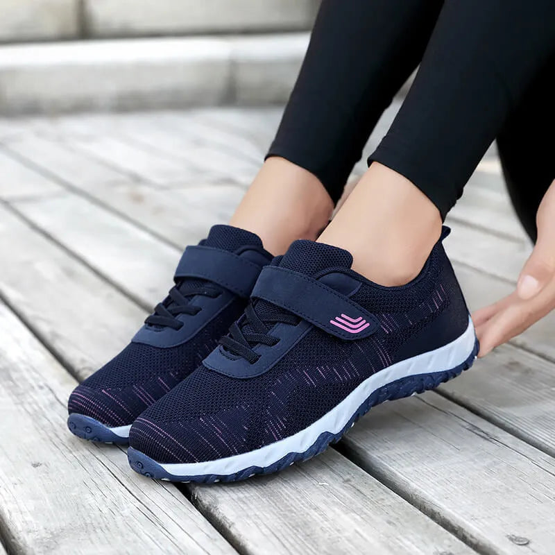 Women's low-top grey purple wedge heel shoes with velcro strap and breathable mesh upper.