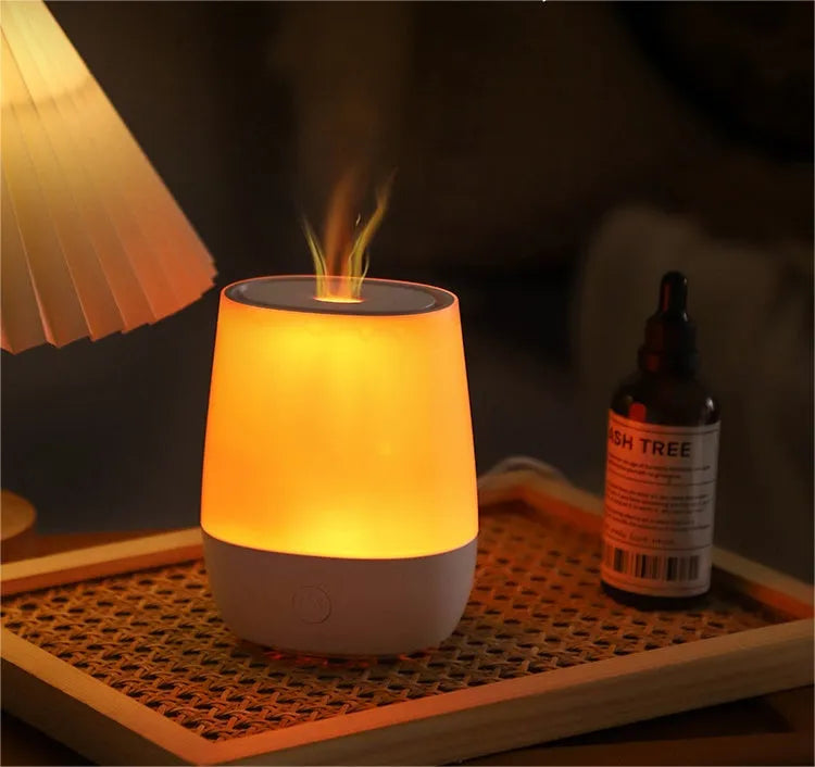 White USB aroma diffuser with simulated flame effect and compact design for bedside use