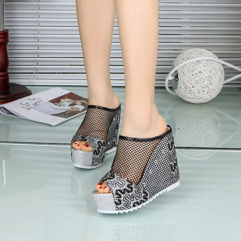 Women's black chunky heel platform sandals with hollowed-out heel design and lace-up mesh upper.