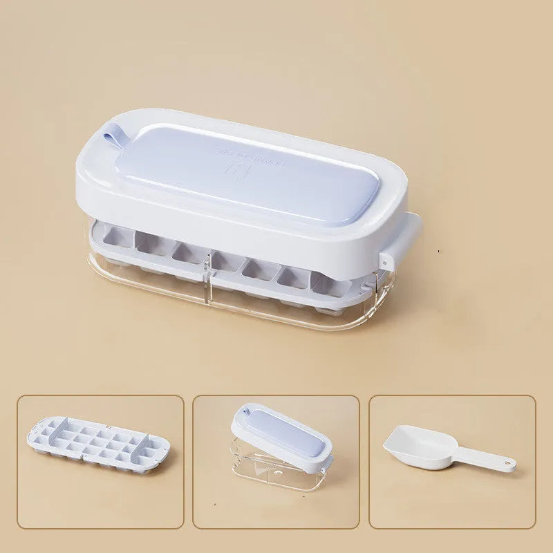 Blue high-capacity ice cube tray with integrated storage for an ice shovel.