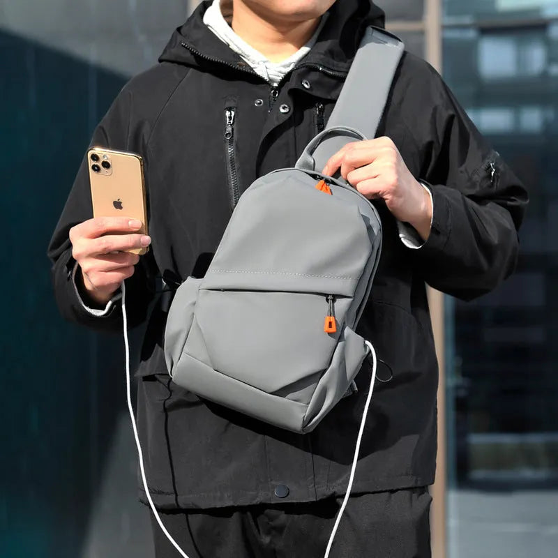 Men's black polyester crossbody bag with single shoulder strap and waterproof features