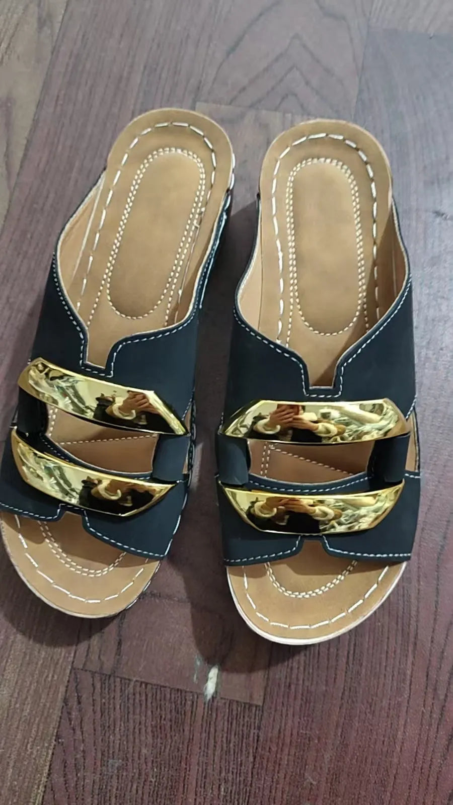 Adult Roman style platform sandals in a solid colour with a strap design and flat rubber sole.