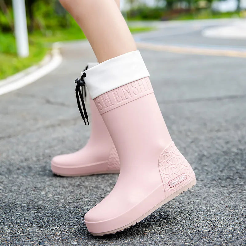 Women's PVC rain boots in apricot colour with non-slip soles and waterproof mouth detailing