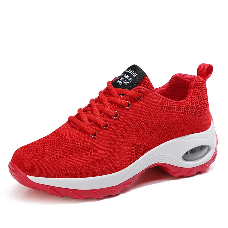 Women's red mesh sneakers with front lace-up design, round toe, and flat mid heel