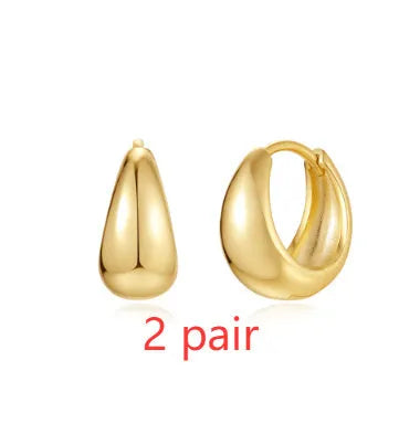 Geometric brass diamond earclip earrings with round accents in golden electroplated finish