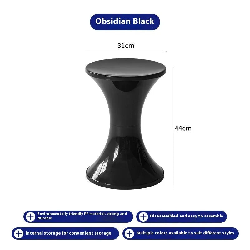 A plastic hourglass-shaped stool for changing shoes, shown in one of five available colours.