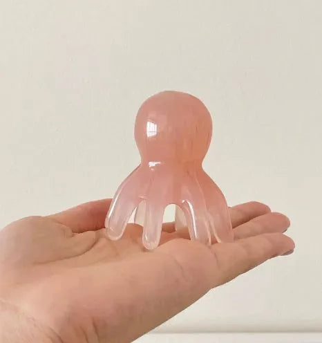 Pink octopus-shaped natural resin massage comb for facial periocular meridian acupressure