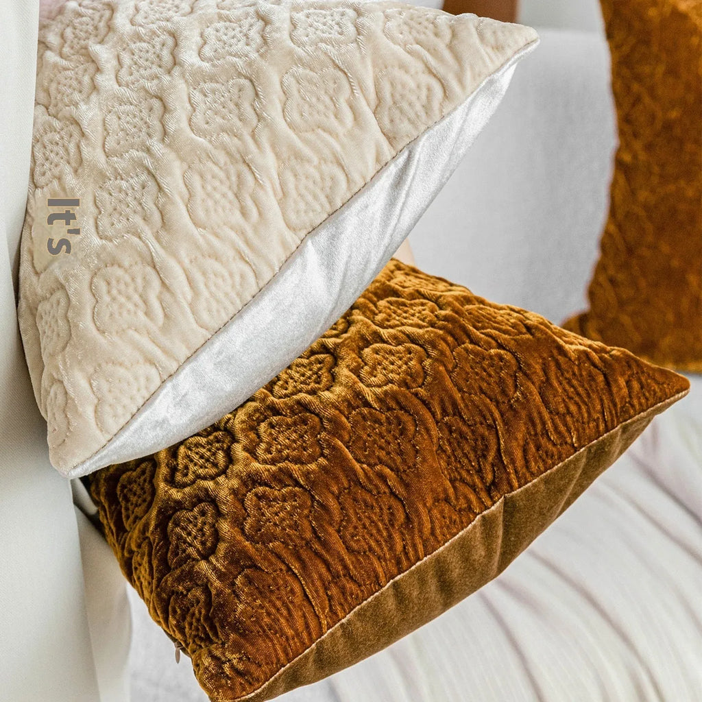 Brown gold antique-style three-dimensional quilted cushion pillow on a sofa
