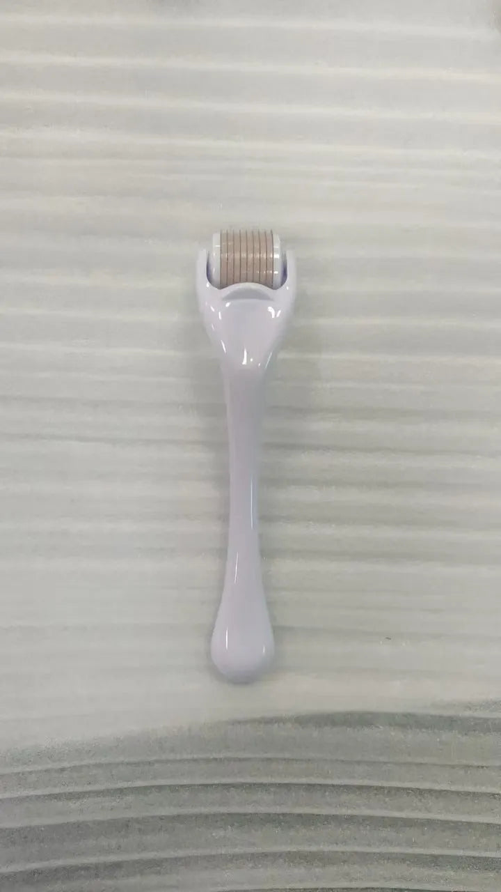 540 micro needle derma roller showing handle and needle wheel in a selected colour