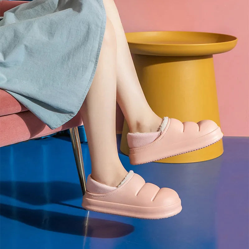 Waterproof EVA winter slippers with plush lining in multiple colours showing non-slip soles