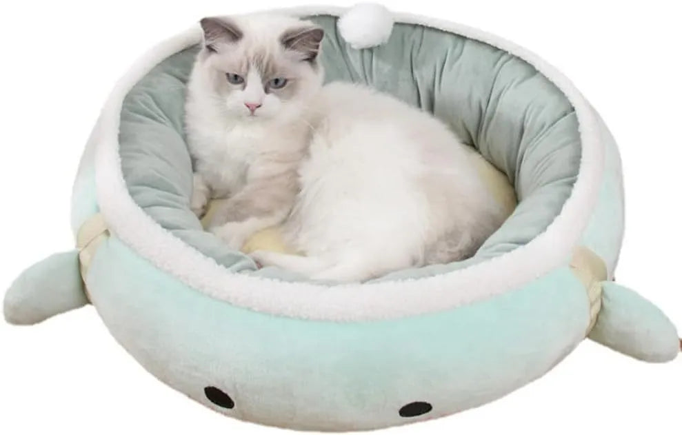 Green dinosaur and chick shaped cat bed shown both flat as a sofa and hanging as a hammock for small pets.