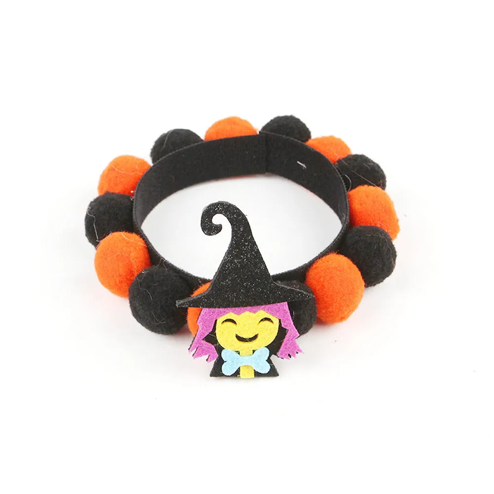 Halloween pet collar with a fur ball decoration in a pumpkin design, shown in size M