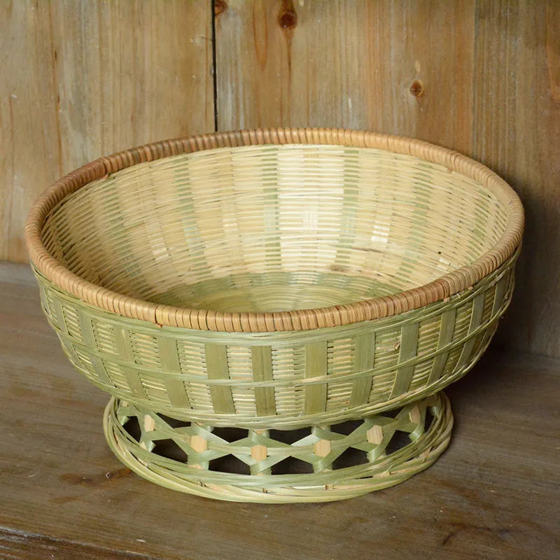 Handmade woven bamboo storage basket in natural colour showing traditional craftsmanship