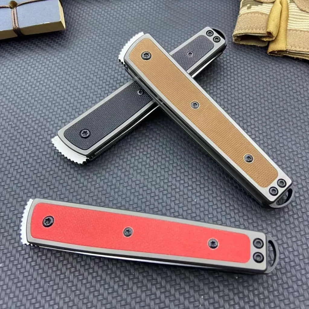 Folding fruit knife with stainless steel blade in black, brown, or red colour options showing closed and open positions