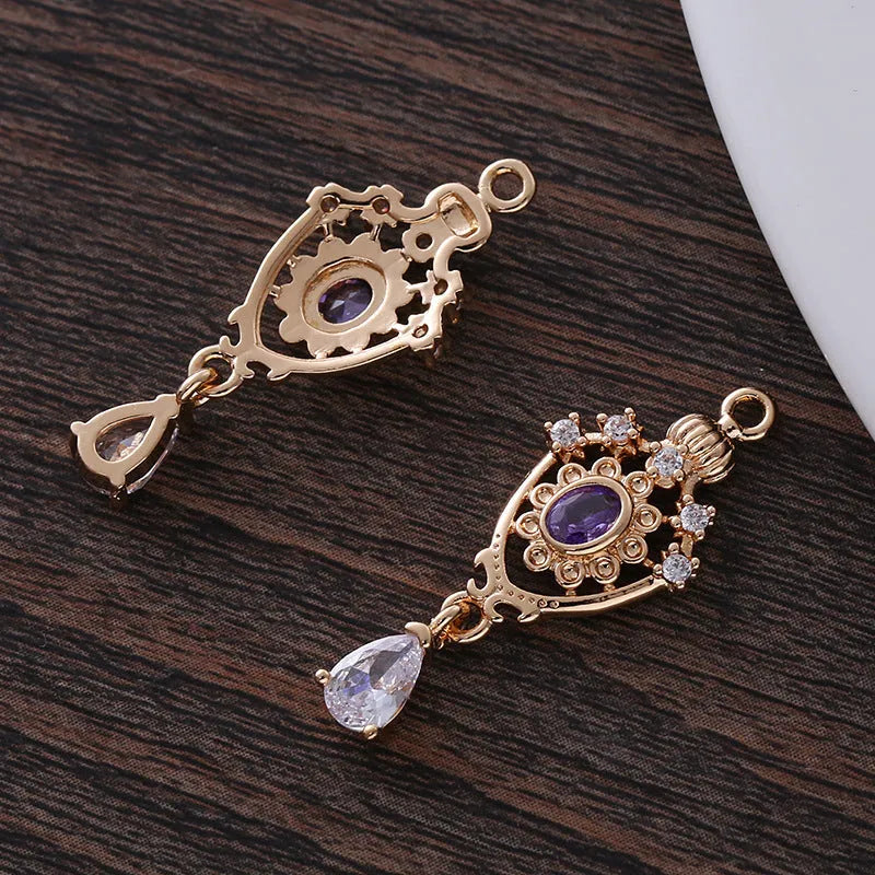 Water drop pendant with zircon crown detail in copper with electroplated finish.