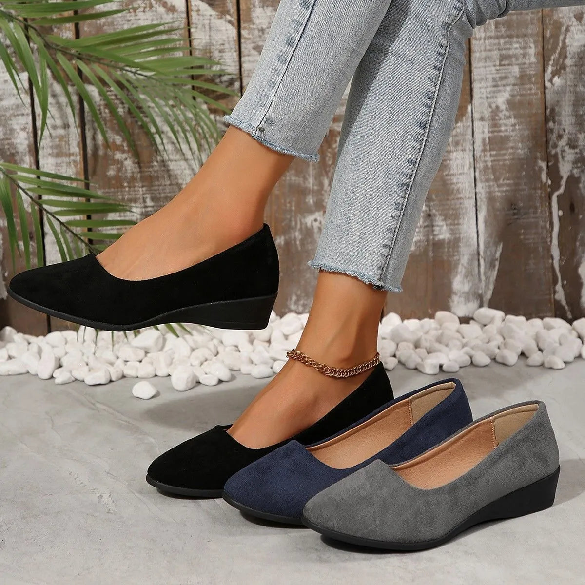 Women's suede wedge pumps in light brown colour showing shallow mouth design and low wedge heel