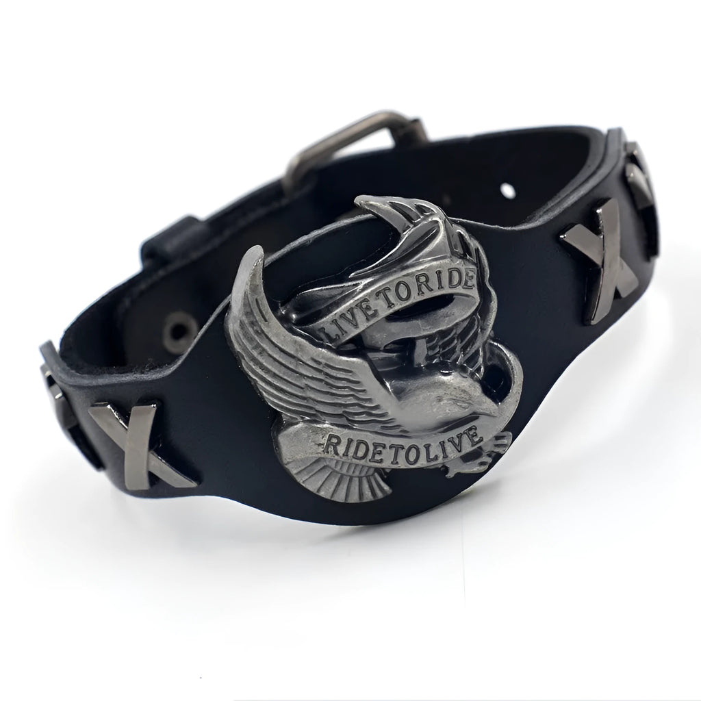Black geometric leather bracelet with a silver watch-button clasp on a unisex wrist.