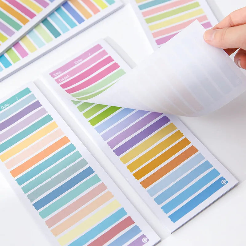 Colourful cartoon sticky note pad in plastic storage box, size 90 by 248 millimetres.