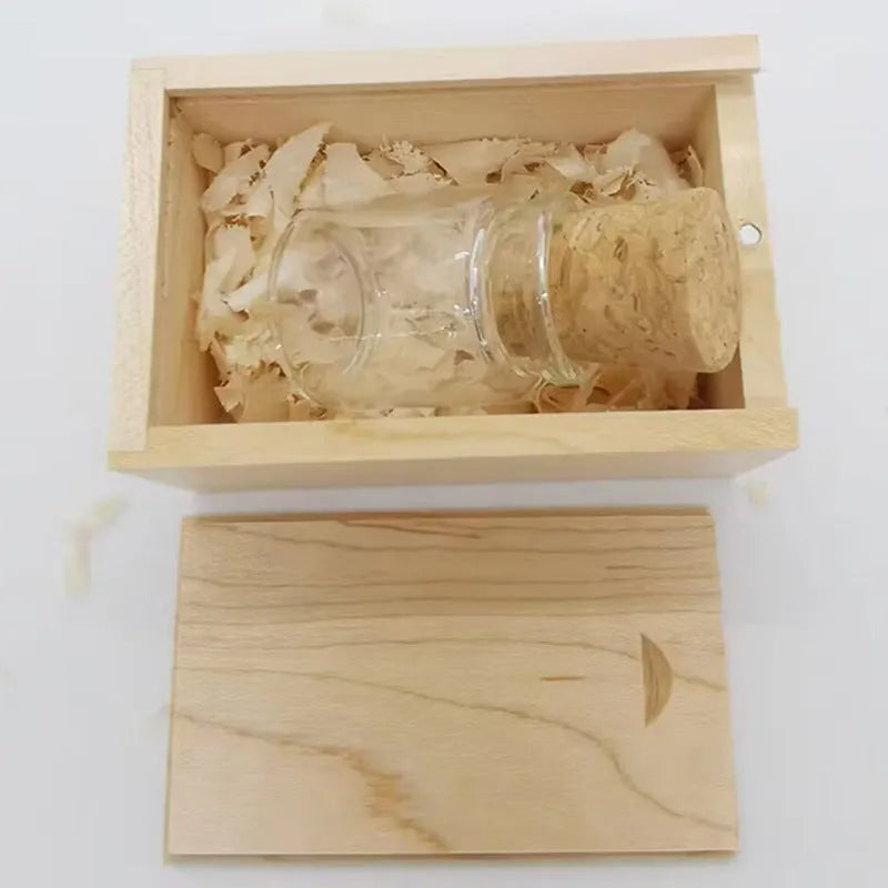 Transparent glass bottle USB flash drive with a wooden stopper cap, 60mm long.