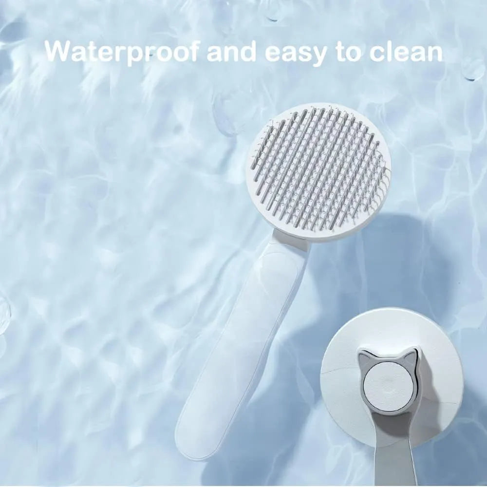 Self-cleaning cat brush with blue rubber handle and metal pins with rubber tips for pet grooming