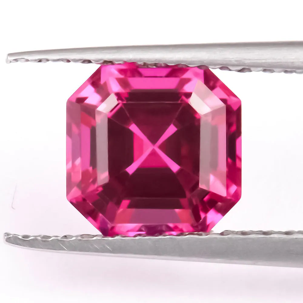 Laboratory-created pigeon blood red ruby gemstone showing different cutting styles including round, princess, and water drop