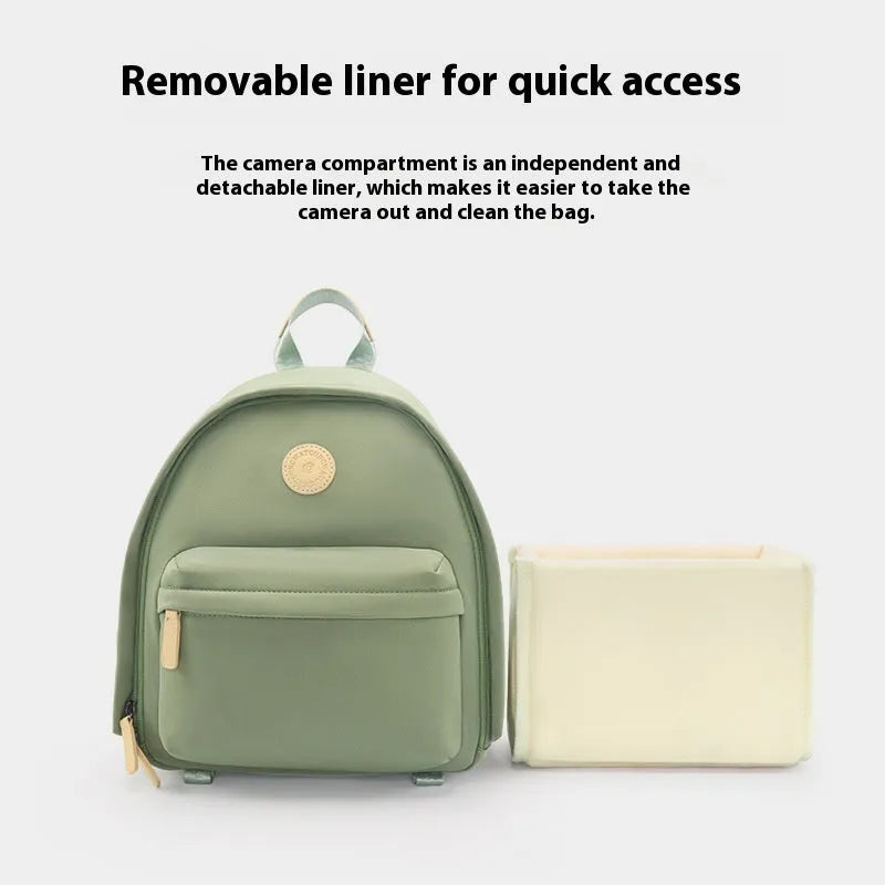 Women's solid-colour shoulder camera bag with a detachable iPad pocket in splash-proof polyester fabric.