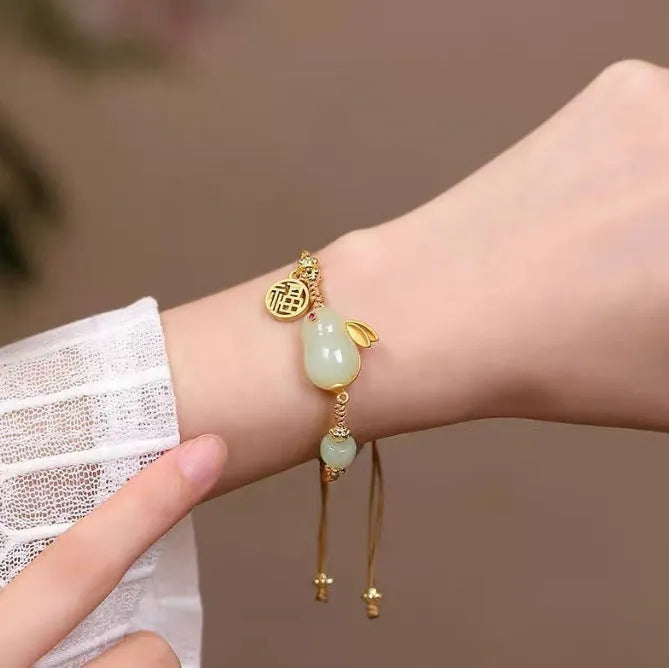 Hetian jade rabbit bracelet with geometric charm on yellow string for women