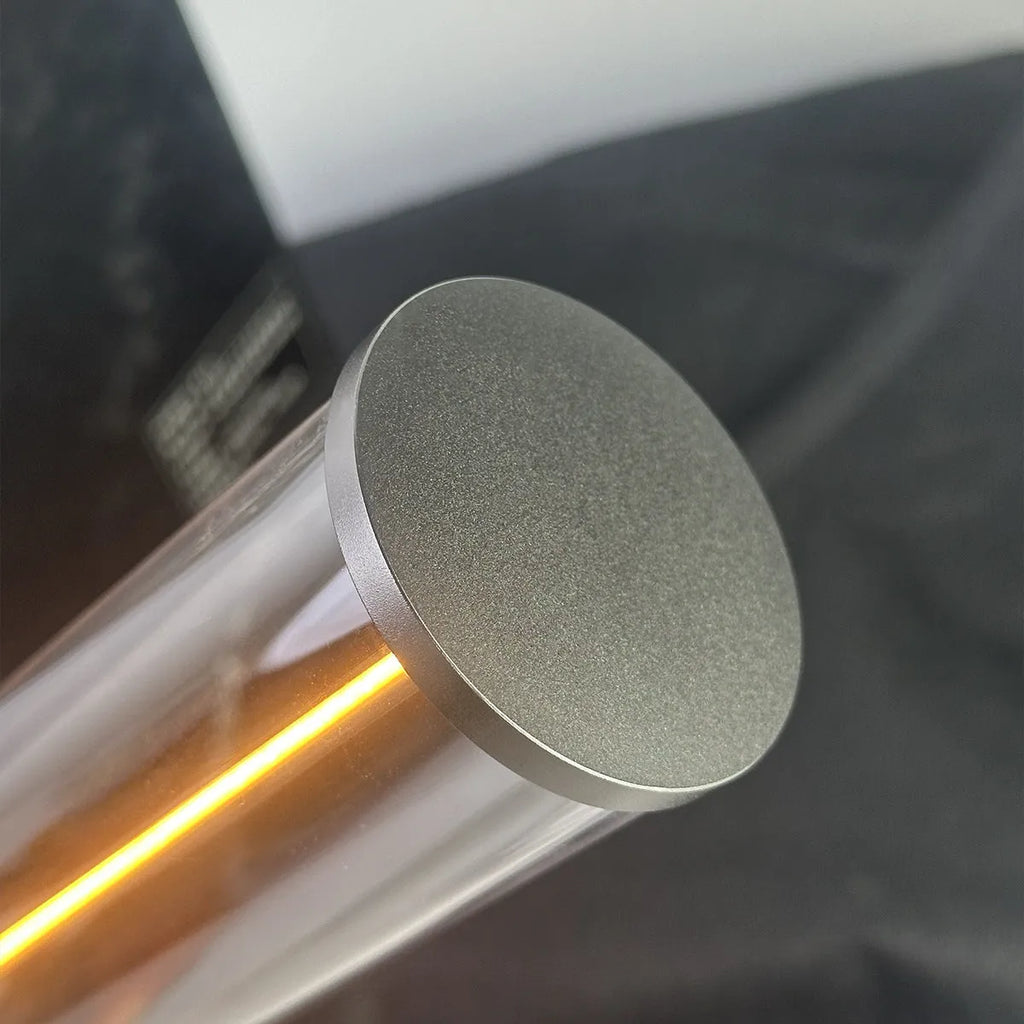 Modern glass and metal LED line light strip with magnetic back for USB-charged night lighting