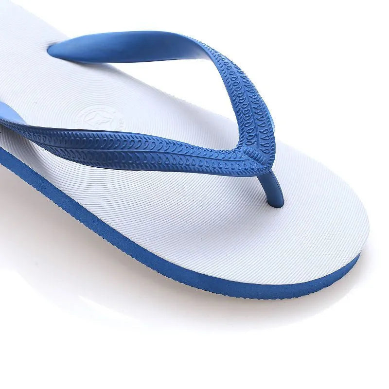 Men's rubber flip-flops in green with a fish label on the strap, showing the non-slip tread pattern on the sole.
