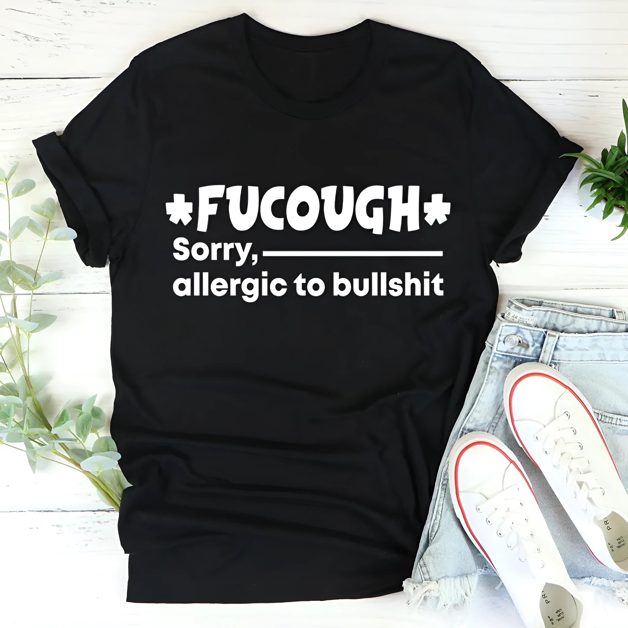 Black straight-cut cotton T-shirt with short sleeves and round neck on hanger
