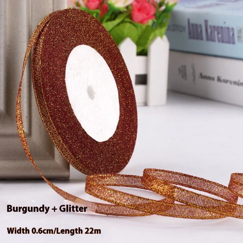 Roll of narrow 0.6cm wide polyester satin ribbon in a choice of colours, showing 22 metre length.