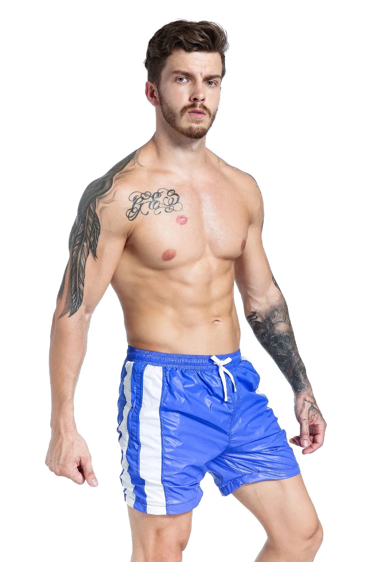 Men's blue slim fit lace-up sports shorts made from stretch polyester with built-in padding.