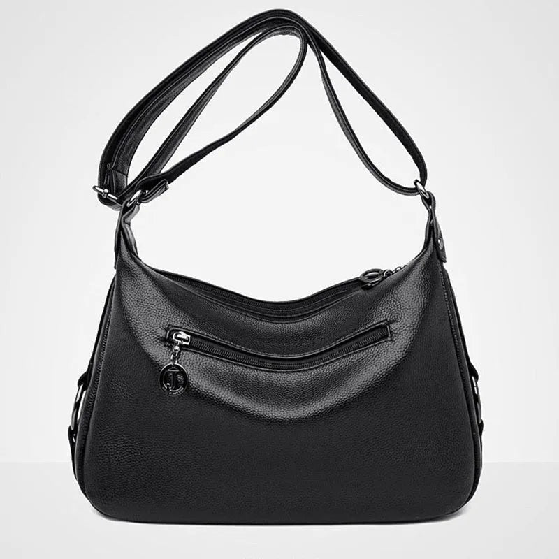 Large black PU shoulder bag with multiple internal compartments showing phone and document sections