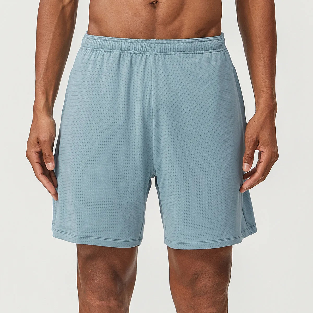 Man's quick-drying athletic shorts in khaki colour, showing double-layer construction and mid-waist fit.
