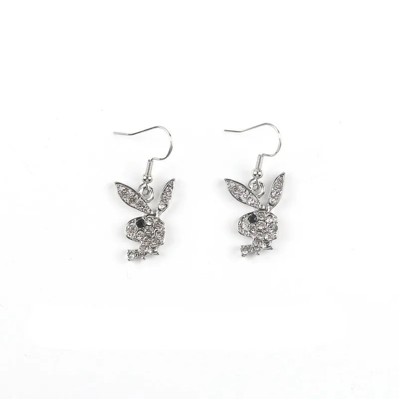 Silver, pink, and gold alloy stud earrings with a full diamond cartoon rabbit design.