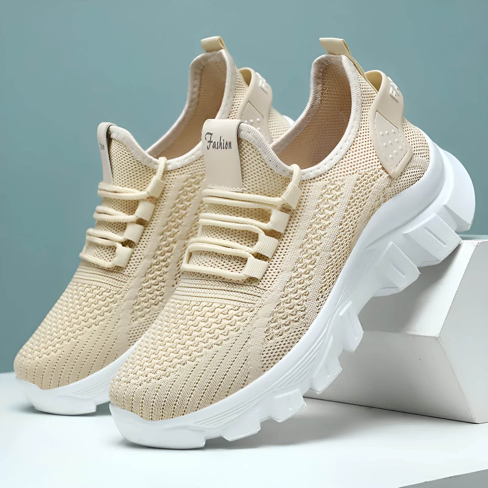 Men's white Flyknit sneakers with a thick PVC sole and round toe on a plain background.