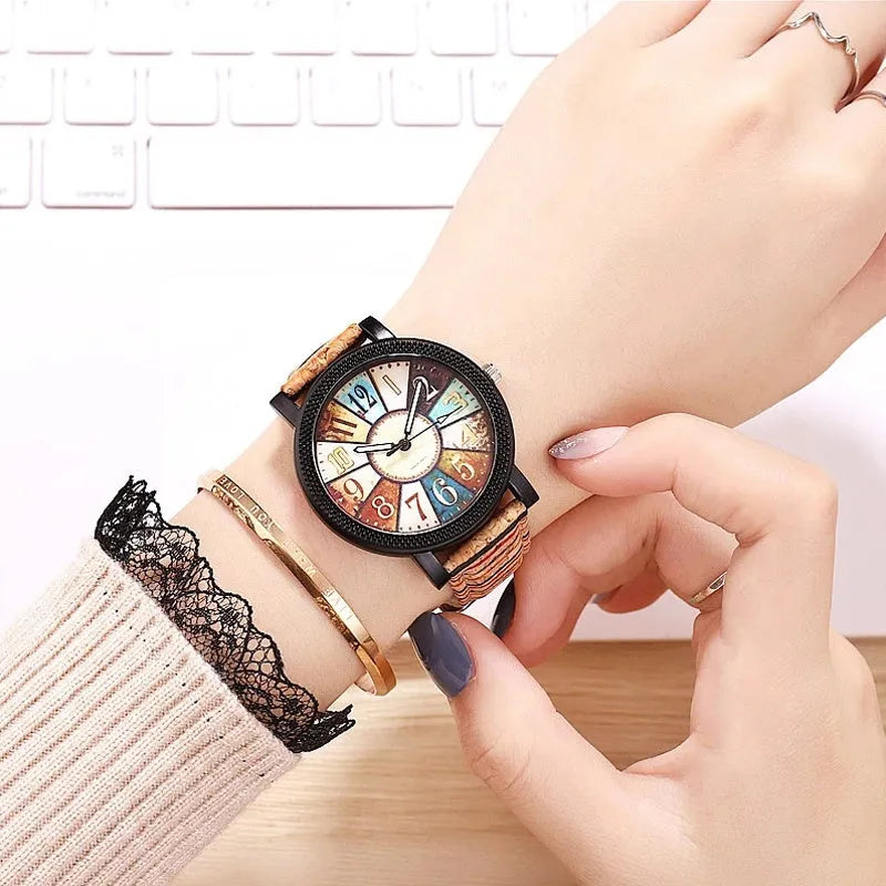 Vintage style women's leather strap quartz watch with round 37mm dial and stainless steel buckle.