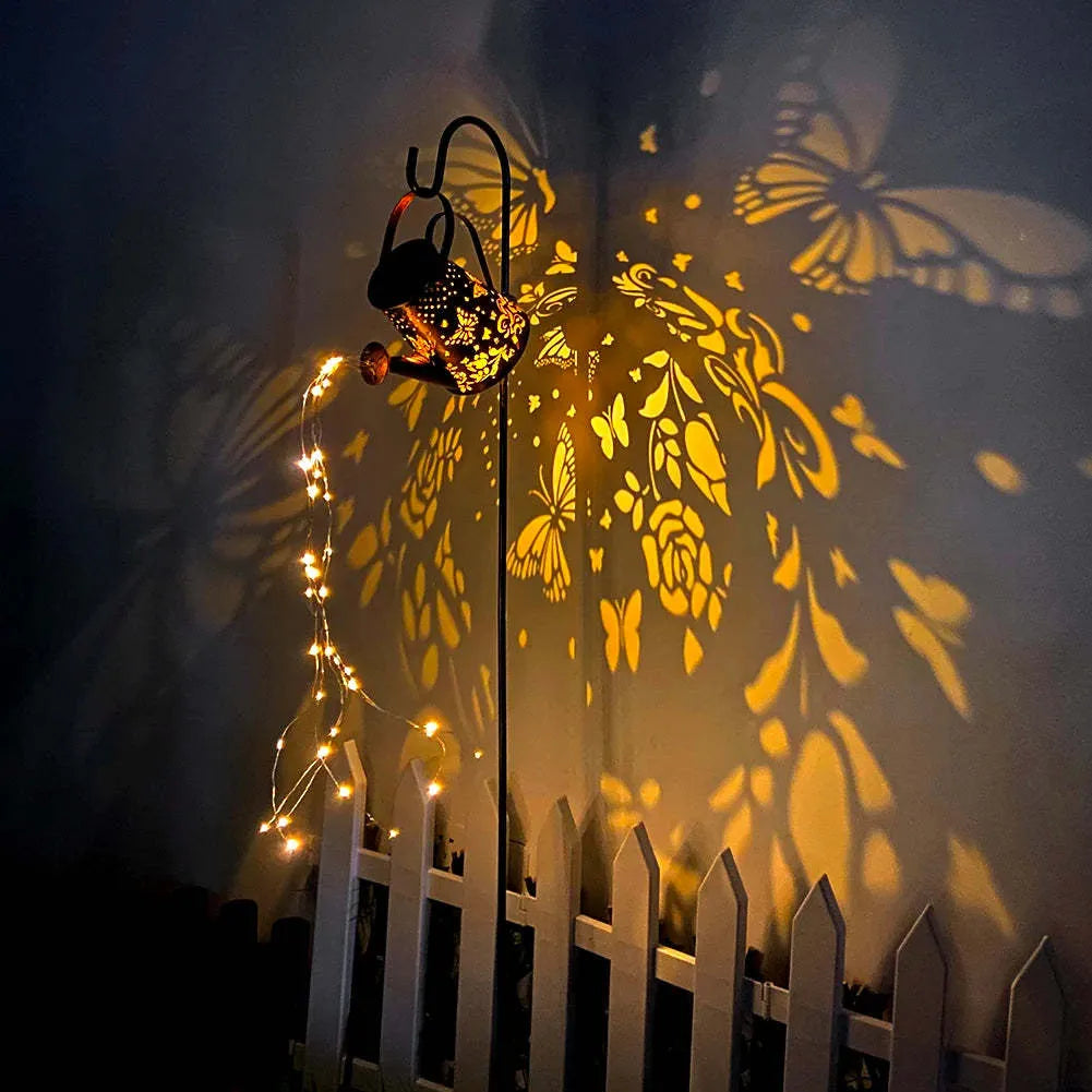 Solar garden lamp with tapered butterfly silhouette design in iron construction