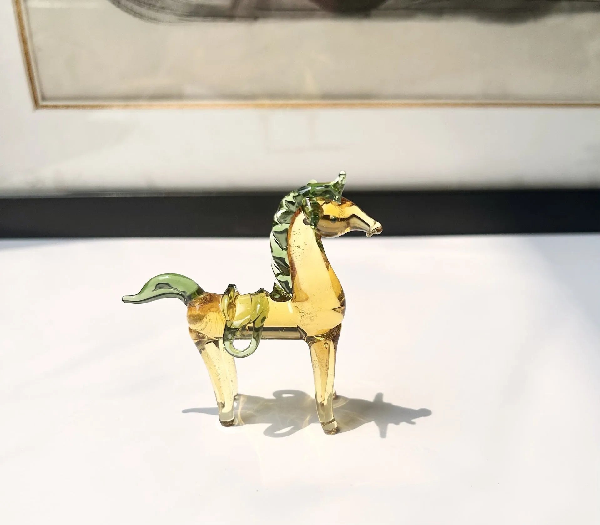 Brown glazed ceramic horse decoration on wooden desk with modern simplicity design