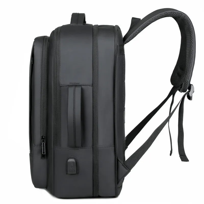 Black business backpack with curved shoulder straps showing waterproof Oxford cloth construction