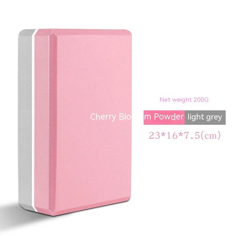 High-density EVA yoga block in violet colour next to a pink block with a cartoon print design.