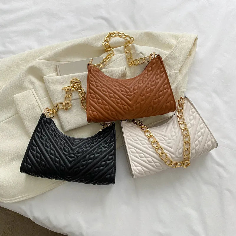 Brown pleated chain baguette shoulder bag showing vertical square shape and adjustable 50cm strap