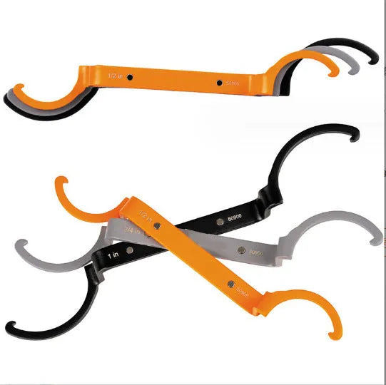 Three colour-coded crescent wrenches with magnetic suction bases: orange, grey and black adjustable spanners