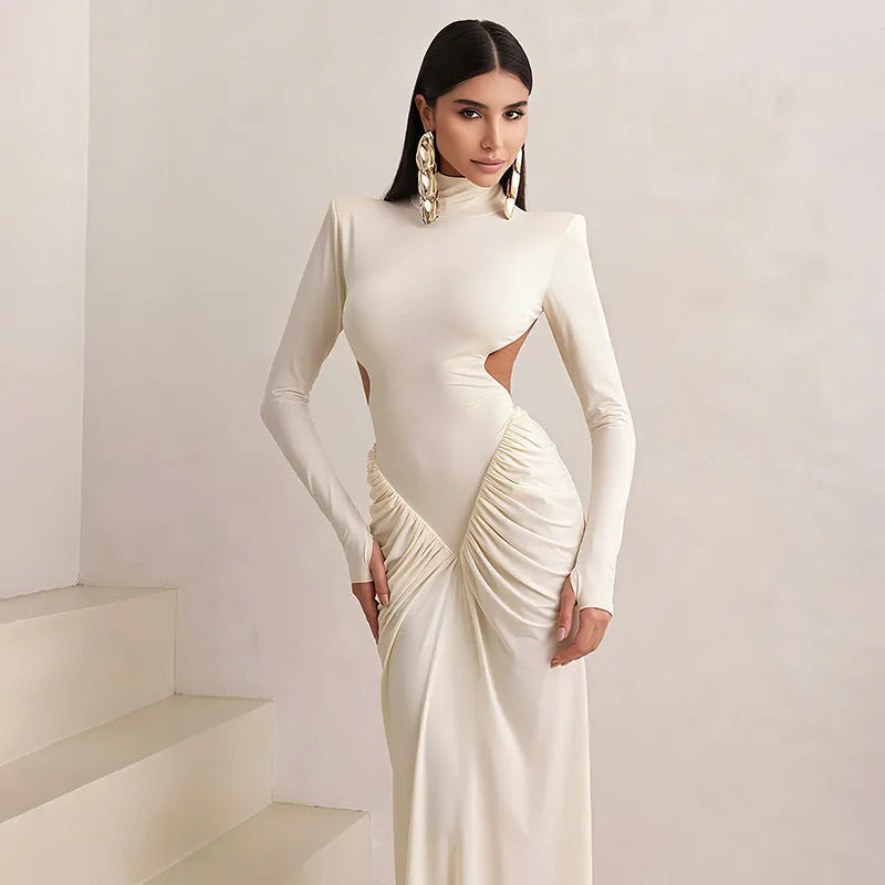Long sleeve slim fit pleated backless dress with a high collar in a solid colour.